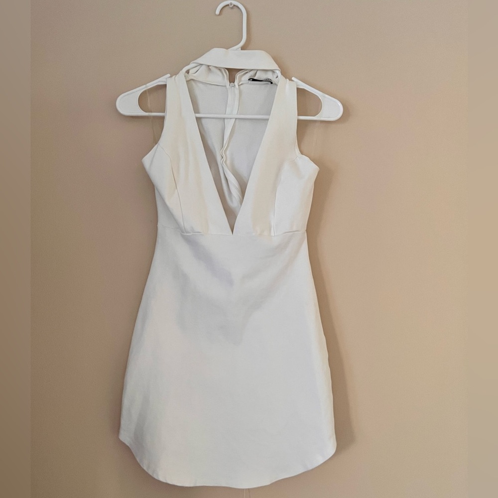 White choker neck, plunging A-line mini dress